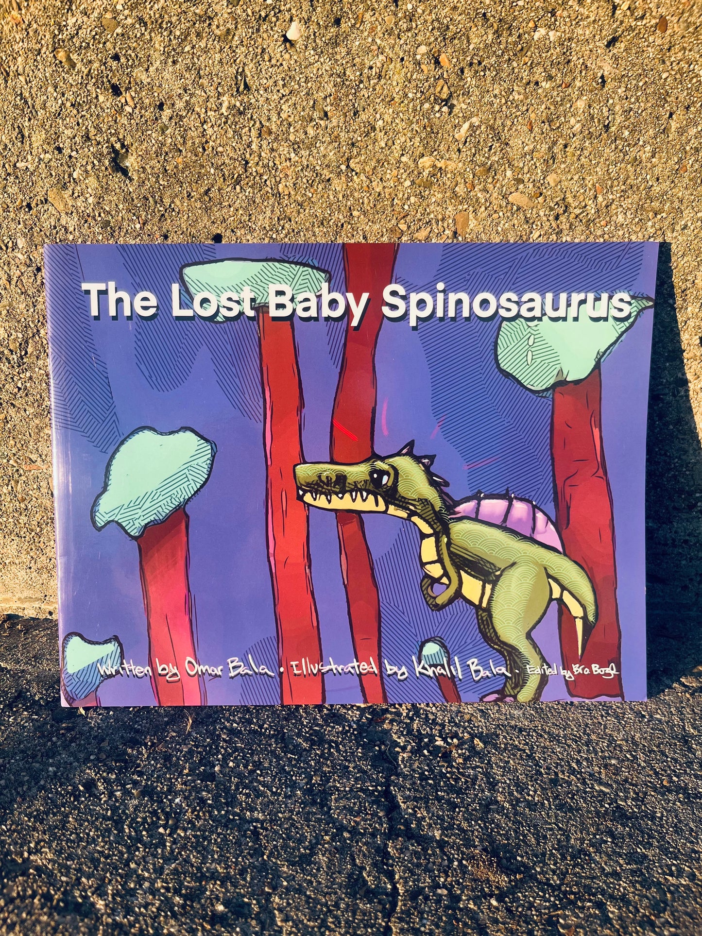 The Lost Baby Spinosaurus book featuring an educational and heartwarming story of a baby dinosaur exploring the prehistoric world to reunite with his family.